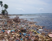 Dump site of a typical Maldivian island. Waste is dumped near the beach, polluting waterways.