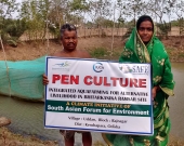 Pampa with her husband in their fish pen